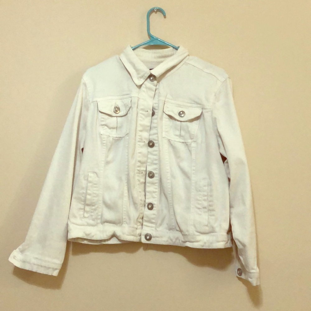 White jean jacket with rhinestone buttons.